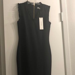 Calvin Klein black dress. Dress is past knee